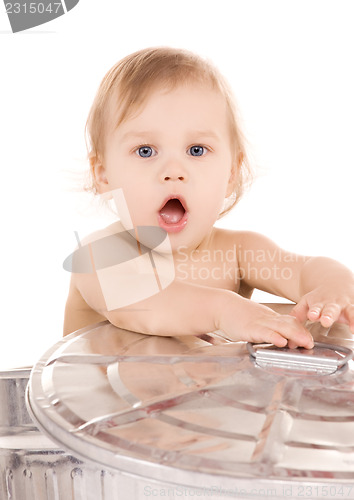 Image of baby in trash can