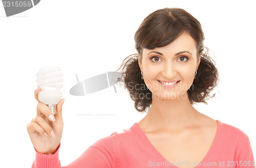 Image of woman holding energy saving bulb