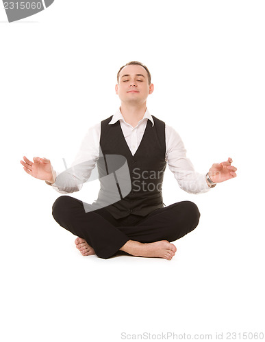 Image of businessman sitting in lotus pose