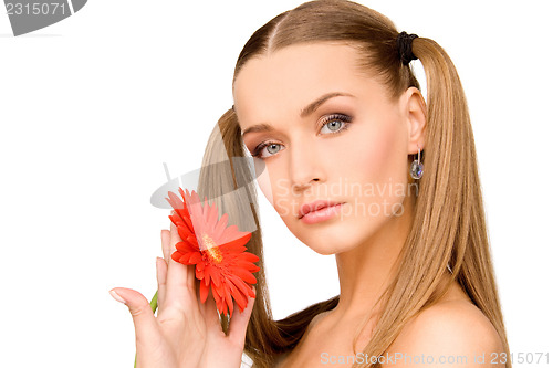 Image of woman in towel with red flower