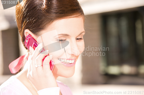 Image of happy woman with cell phone