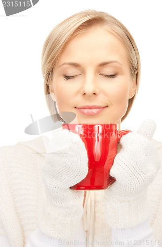 Image of beautiful woman with red mug