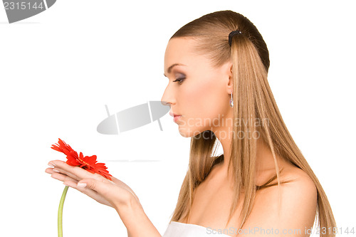 Image of woman in towel with red flower