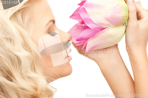 Image of beautiful woman with lotus flower