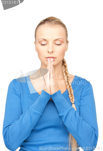 Image of praying businesswoman