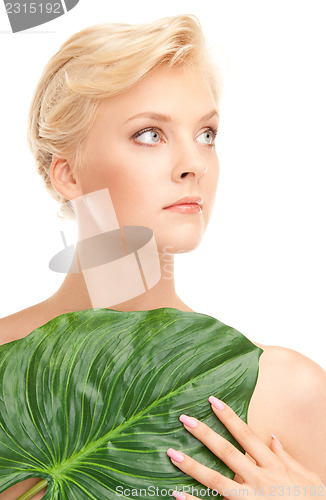 Image of woman with green leaf