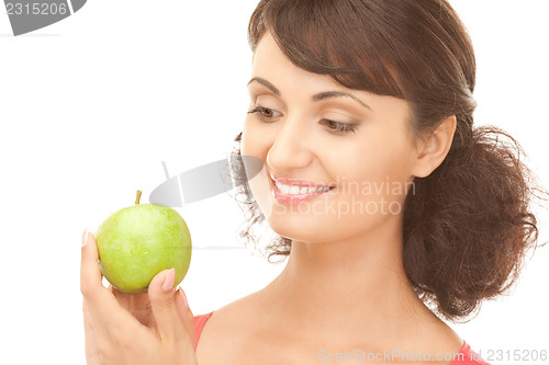 Image of young beautiful woman with green apple
