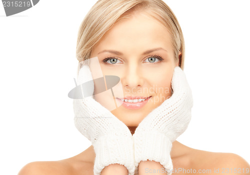 Image of beautiful woman in white mittens 