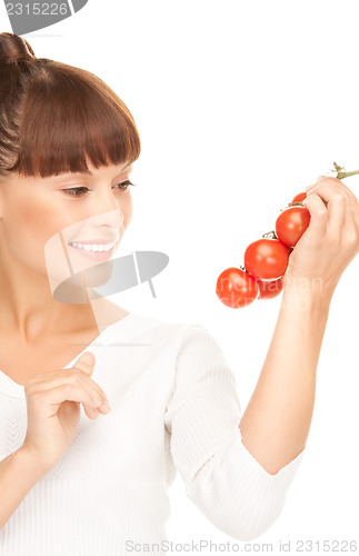 Image of woman with ripe tomatoes