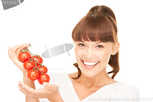 Image of woman with ripe tomatoes