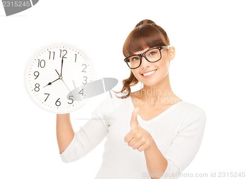 Image of woman holding big clock