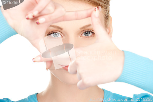 Image of lovely woman creating a frame with fingers