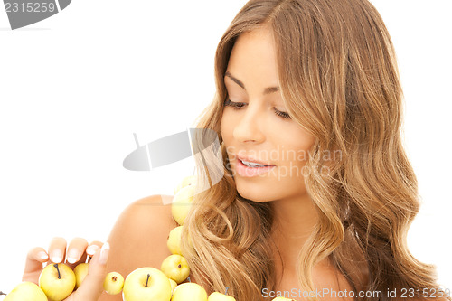 Image of lovely woman with green apples 