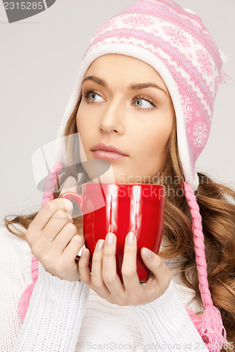 Image of beautiful woman with red mug