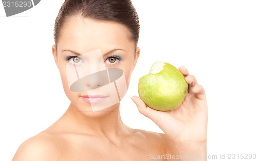 Image of young beautiful woman with green apple