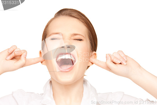 Image of woman with fingers in ears