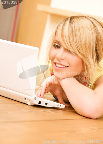 Image of teenage girl with laptop computer