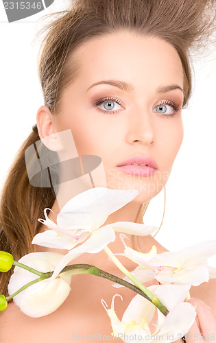 Image of beautiful woman with white flower