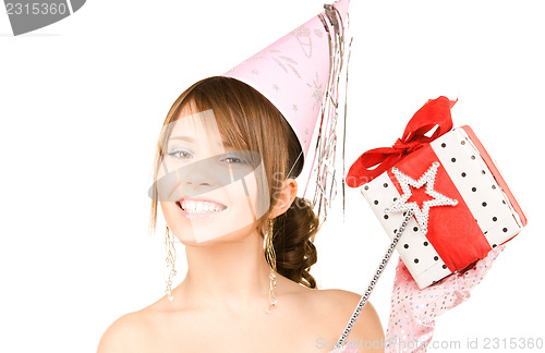 Image of teenage party girl with magic wand and gift box