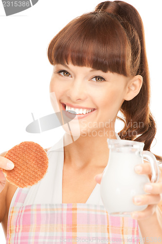 Image of housewife with milk and cookies