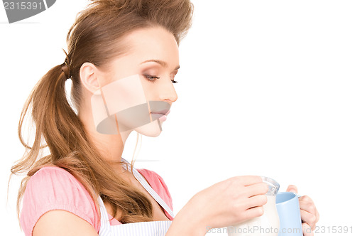 Image of housewife with milk and mug