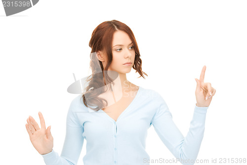Image of businesswoman working with something imaginary