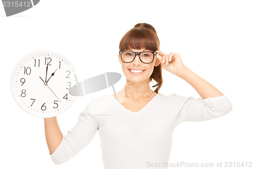 Image of woman holding big clock