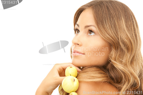 Image of lovely woman with green apples