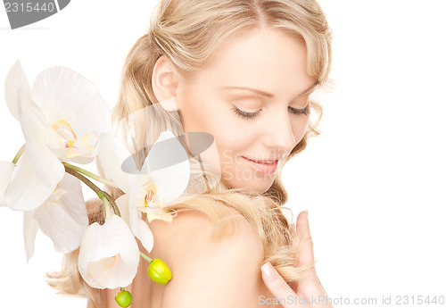 Image of beautiful woman with white flower