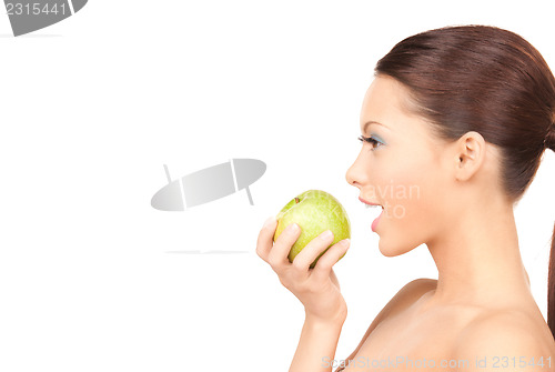 Image of young beautiful woman with green apple