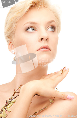 Image of lovely woman with twig