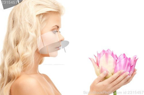 Image of beautiful woman with lotus flower