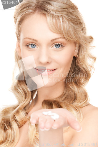 Image of young woman with pills