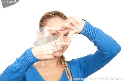 Image of lovely woman creating a frame with fingers