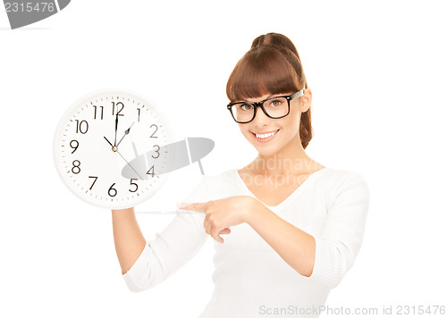 Image of woman holding big clock