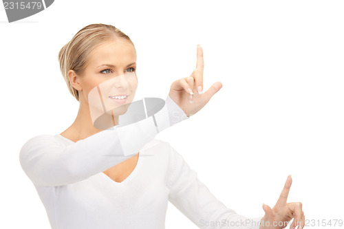 Image of businesswoman working with something imaginary
