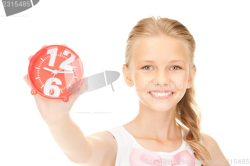 Image of girl holding alarm clock