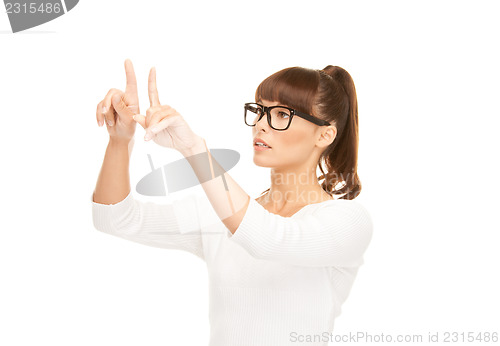 Image of businesswoman working with something imaginary
