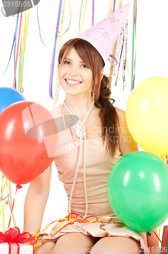 Image of party girl with balloons and gift box