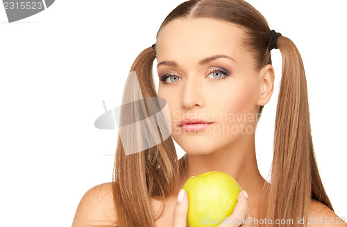 Image of young beautiful woman with green apple
