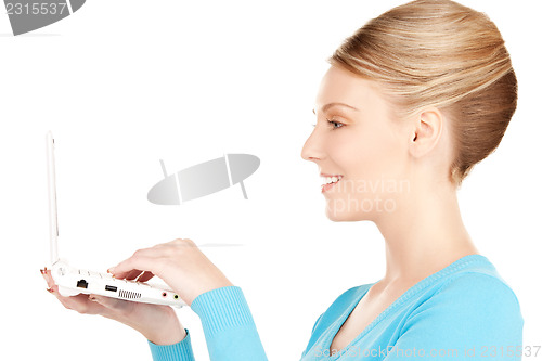 Image of happy woman with laptop computer