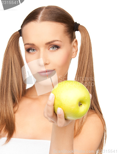Image of young beautiful woman with green apple