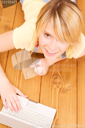 Image of teenage girl with laptop computer