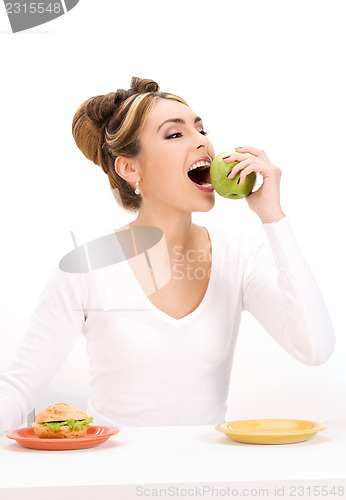 Image of woman with green apple and sandwich