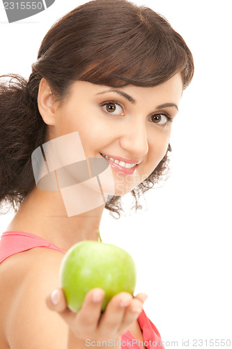 Image of young beautiful woman with green apple