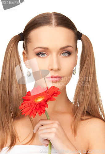 Image of woman in towel with red flower