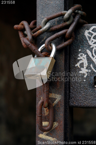 Image of Padlock and chain on a gate