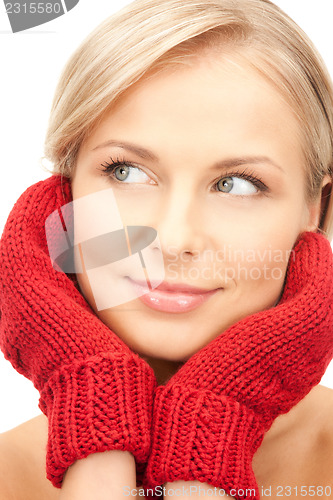 Image of beautiful woman in red mittens 