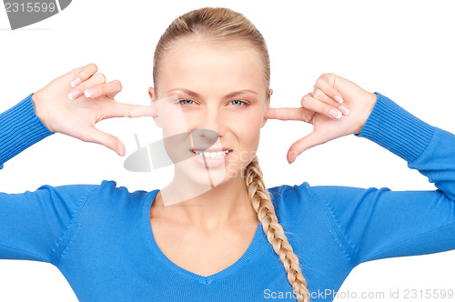 Image of woman with fingers in ears