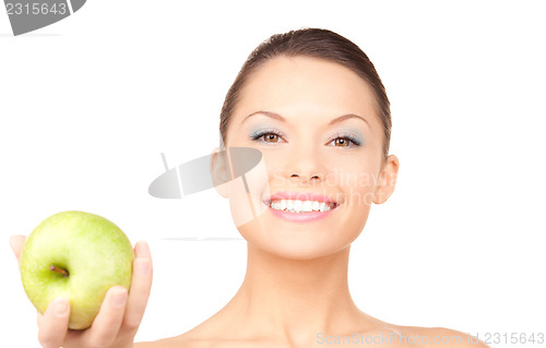 Image of young beautiful woman with green apple